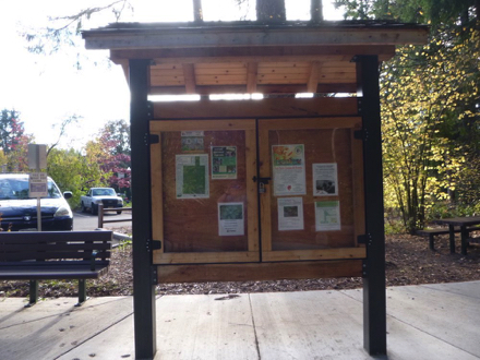 Kiosk near the parking lot has Park information and a map